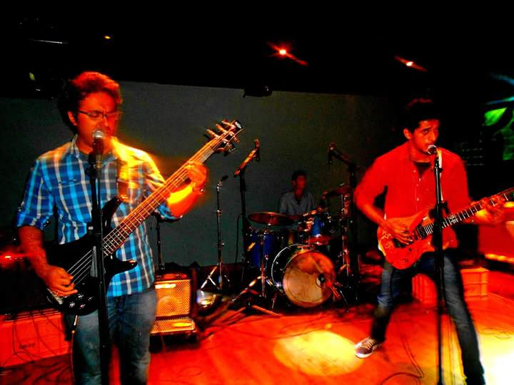 Hardhik performing live on stage with the band in Bangalore.